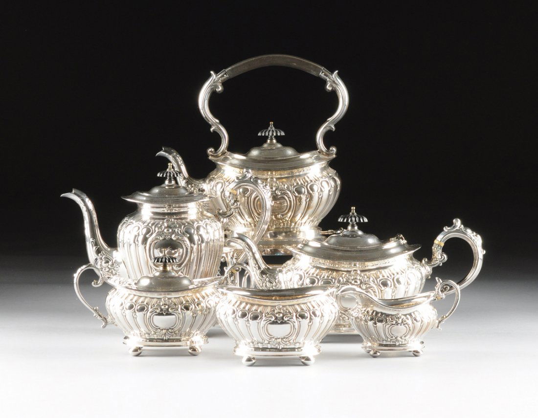 A SIX PIECE WILLIAM ADAMS SILVER PLATED TEA AND COFFEE: A SIX PIECE WILLIAM ADAMS SILVER PLATED TEA AND COFFEE SERVICE, SHEFFIELD, ENGLAND, 20TH CENTURY, the tea and coffee service comprising a hot water kettle on stand, tea pot, coffee pot, covered sugar