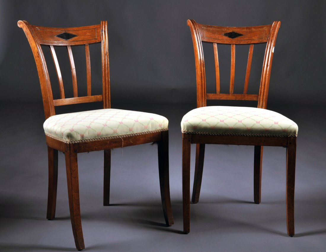 A PAIR OF BALTIC NEOCLASSICAL BRASS INLAID CARVED WOOD: A PAIR OF BALTIC NEOCLASSICAL BRASS INLAID CARVED WOOD CHAISES, POSSIBLY RUSSIAN, EARLY 19TH CENTURY, each having a flaring curved rectangular crest rail centering an ebonized lozenge within a conform