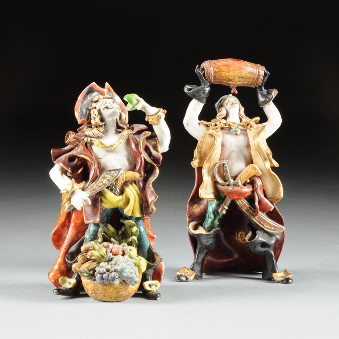 A GROUP OF TWO ITALIAN GLAZED EARTHENWARE PIRATE: A GROUP OF TWO ITALIAN GLAZED EARTHENWARE PIRATE FIGURES DESIGNED BY PROFESSOR EUGENIO PATTARINO, FLORENCE, 1960S, comprising a pirate wearing an open doublet, breeches, tall turned over buckled black