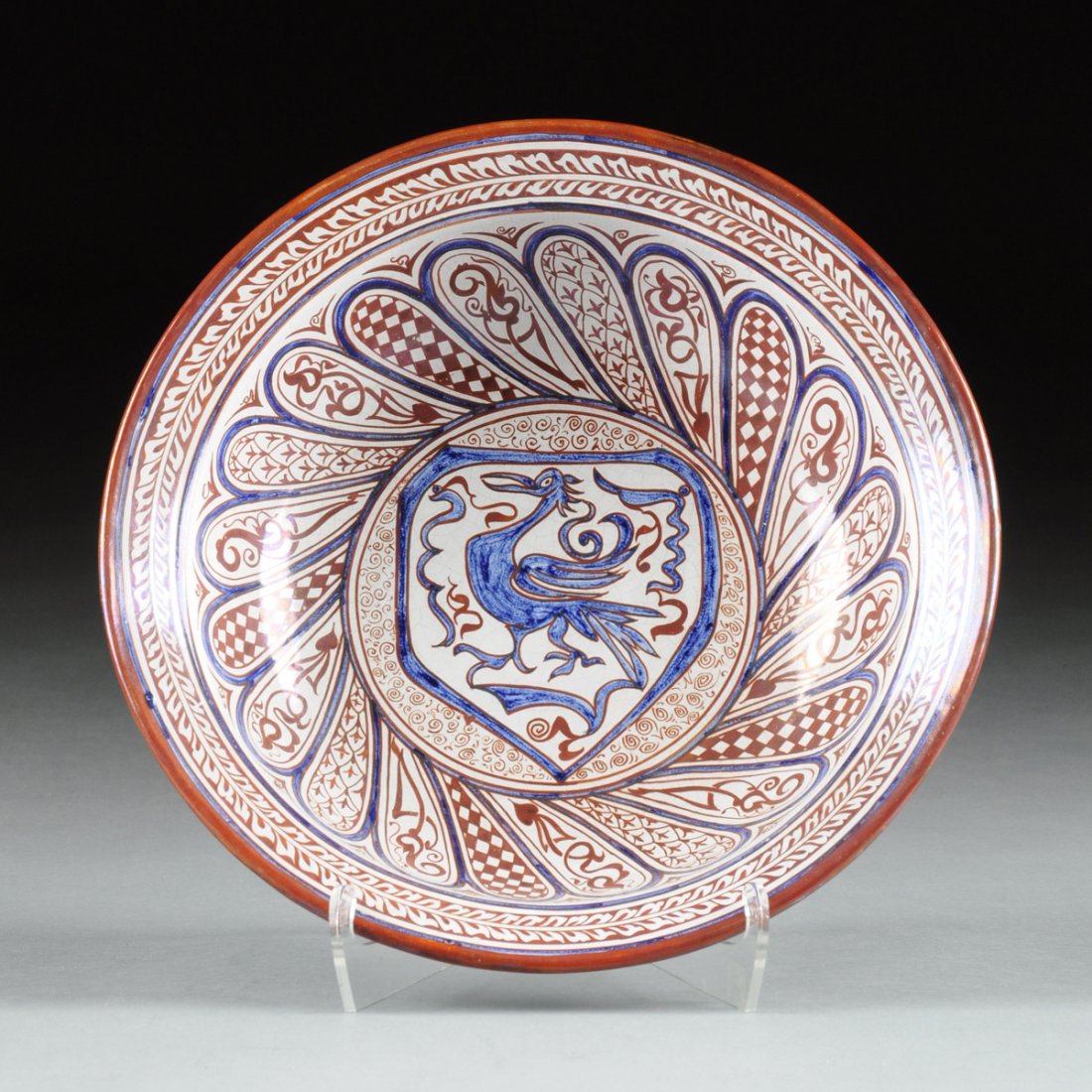 A SPANISH HISPANO MORESQUE LUSTER WARE CERAMIC BOWL BY: A SPANISH HISPANO MORESQUE LUSTER WARE CERAMIC BOWL BY MIGUEL RUIZ JIMENEZ, GRANADA, 20TH CENTURY, the cream glazed earthenware bowl with cobalt blue outlined twisted lobes with copper luster glazed d