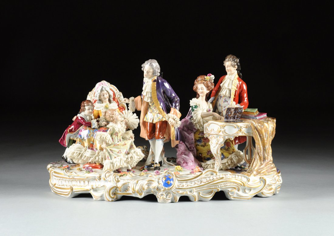 A LARGE VOLKSTEDT POLYCHROME ENAMELED PORCELAIN FIGURAL: A LARGE VOLKSTEDT POLYCHROME ENAMELED PORCELAIN FIGURAL GROUP, RUDOLFSTADT, GERMANY, EARLY 20TH CENTURY, the Rococo style group of a seated female playing a harpsichord with a man looking on, to the l