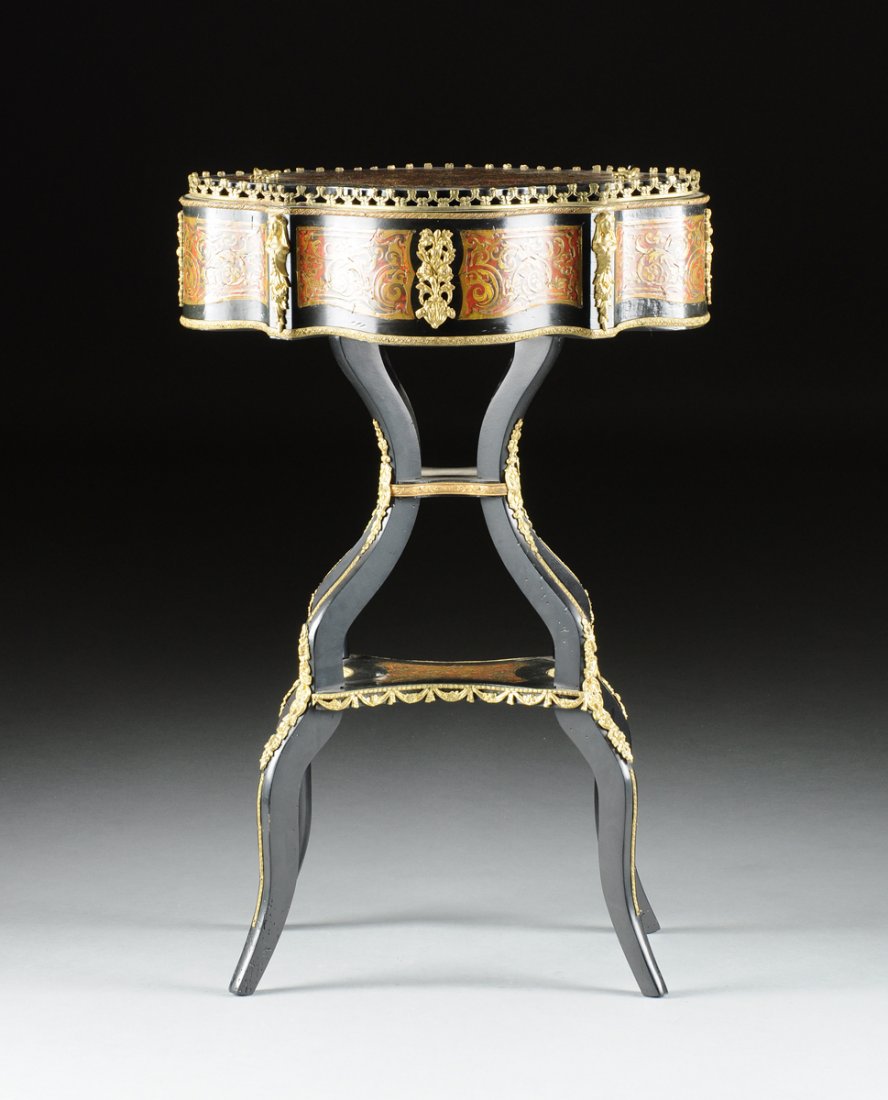 A NAPOLEON III GILT BRONZE MOUNTED BOULLE MARQUETRY: A NAPOLEON III GILT BRONZE MOUNTED BOULLE MARQUETRY SEWING TABLE, THIRD QUARTER 19TH CENTURY, of shaped oval form with a two-handled conforming top centering a scrolling foliate reticulated bronze inl