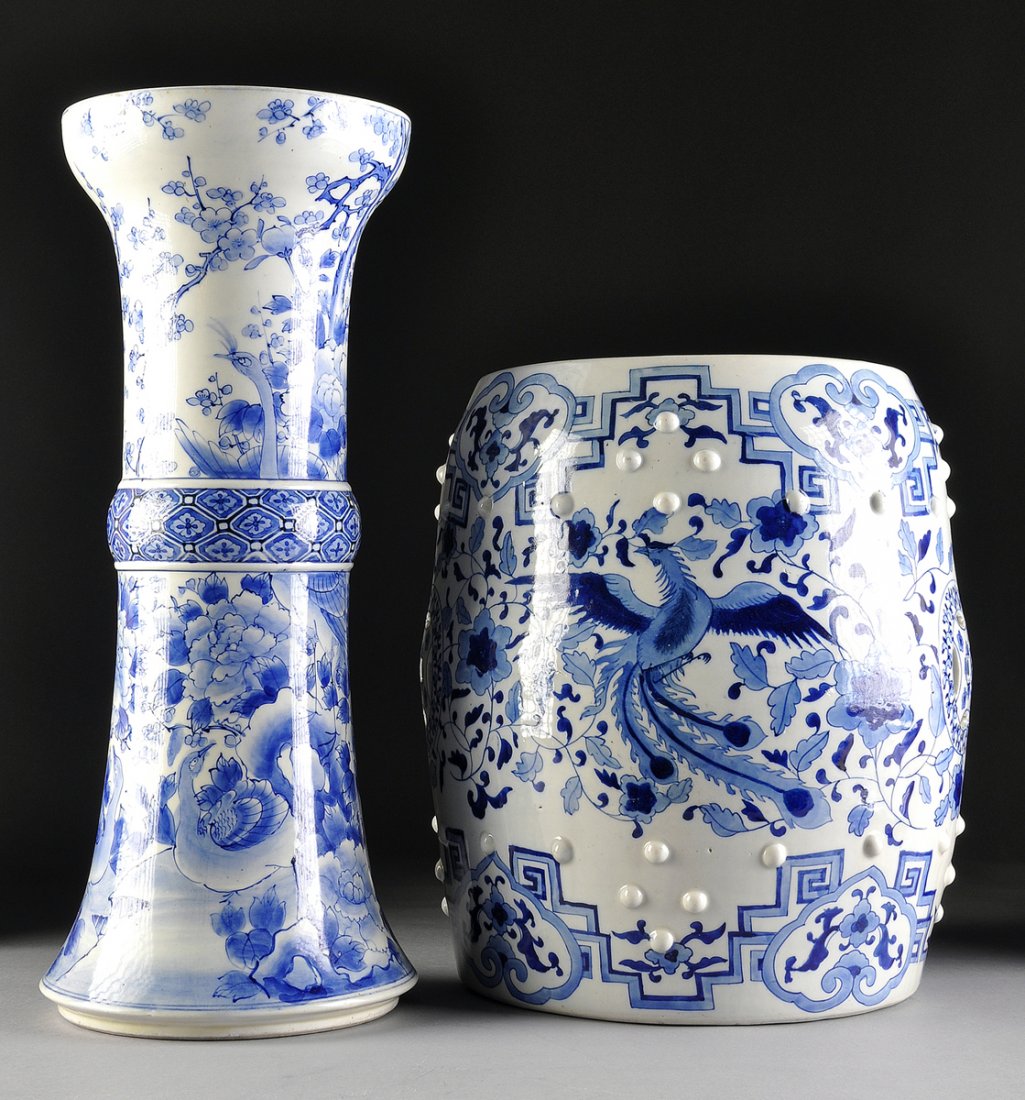 A CHINESE BLUE AND WHITE RETICULATED GARDEN SEAT AND: A CHINESE BLUE AND WHITE RETICULATED GARDEN SEAT AND PEDESTAL, 20TH CENTURY, the garden seat of drum form with bands of raised bosses enclosing a roaring five-claw dragon and pierced paired "cash" sym