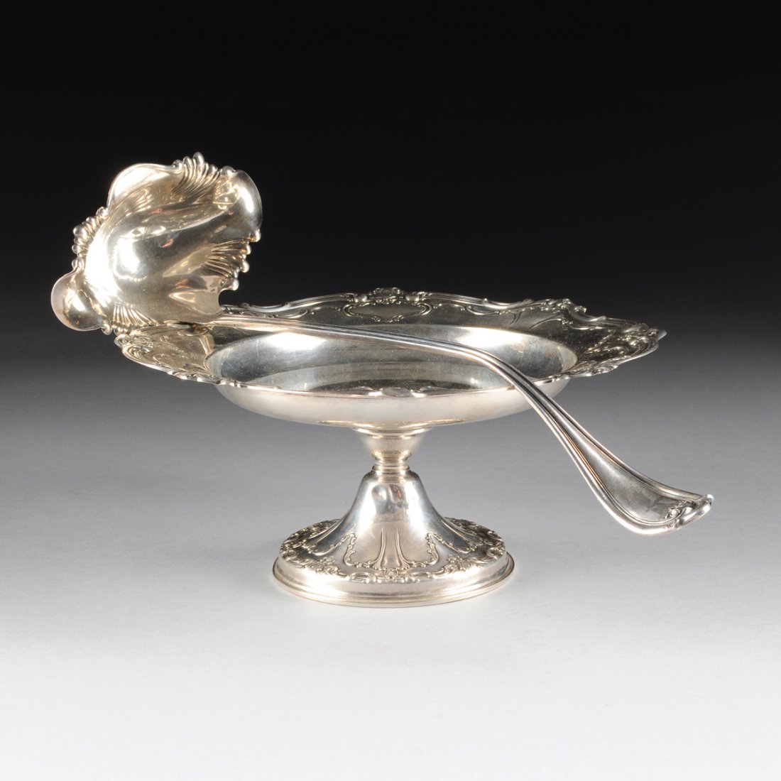 A GORHAM MFG. CO. STERLNG SILVER COMPOTE AND A WM. A.: A GORHAM MFG. CO. STERLNG SILVER COMPOTE AND A WM. A. ROGERS CO. STERLING SILVER PUNCH LADLE, 20TH CENTURY, the Gorham compote with the "Chantilly" pattern with weighted base, marked to the bottom "GO