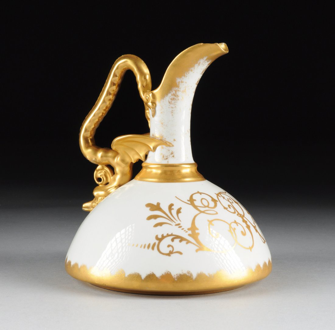 A ROYAL WORCESTER STYLE PORCELAIN WINE EWER WITH DRAGON: A ROYAL WORCESTER STYLE PORCELAIN WINE EWER WITH DRAGON HANDLE, MODERN, the squat bulbous form white glazed porcelain ewer with gilt rimmed everted spout and gilt dragon form handle, the body with gil