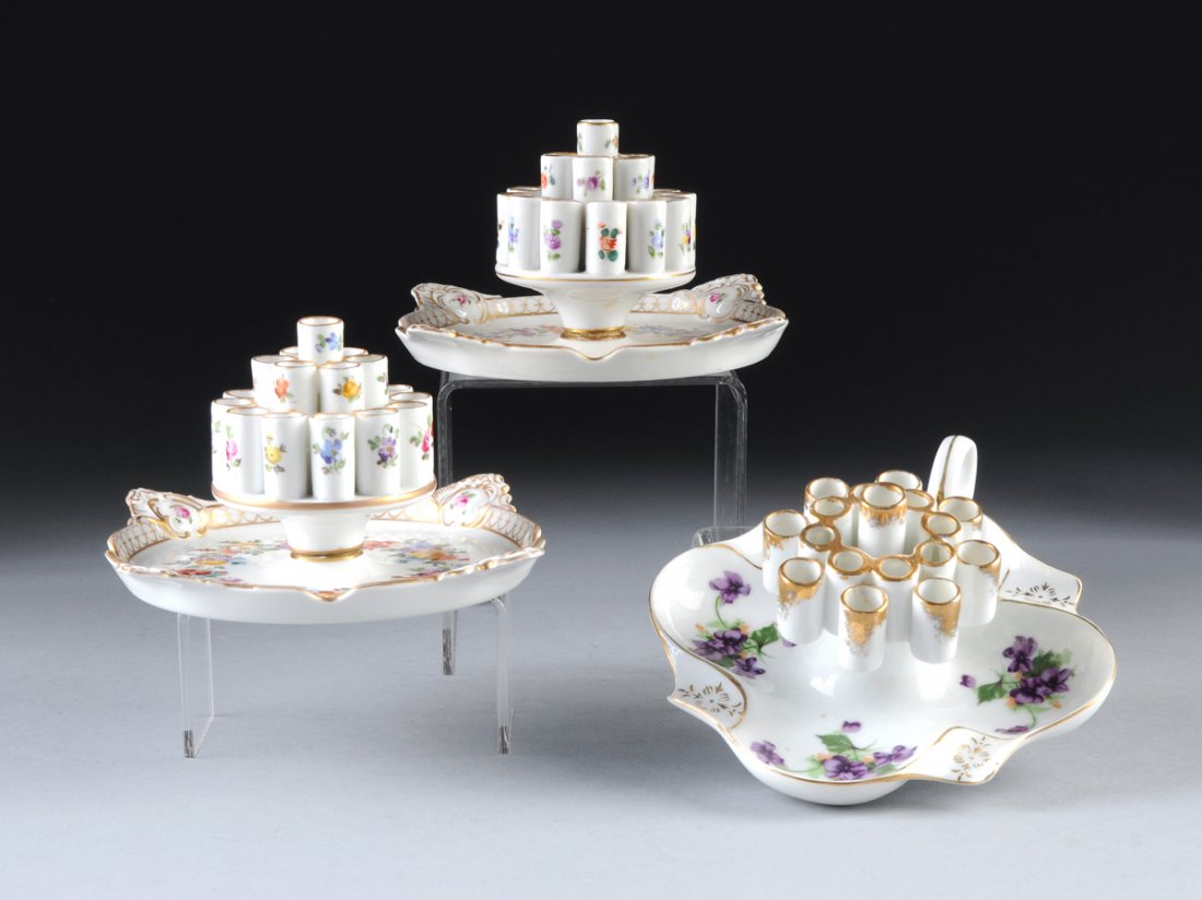 THREE DRESDEN PORCELAIN POLYCHROME DECORATED CIGARETTE: THREE DRESDEN PORCELAIN POLYCHROME DECORATED CIGARETTE HOLDERS, LATE 19TH/EARLY 20TH CENTURY, two painted with polychrome floral sprays and gilt to trim, marked "Dresden/Saxony" to underplate, one in 
