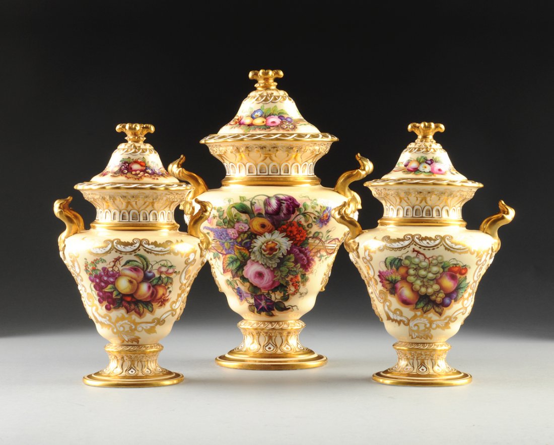 A THREE PIECE COPELAND & GARRETT PARCEL GILT POLYCHROME: A THREE PIECE COPELAND & GARRETT PARCEL GILT POLYCHROME ENAMELED VASE GARNITURE, GREEN AND BLACK PRINTED FELSPAR PORCELAIN MARKS, RED SCRIPT 5375, CIRCA 1840-1845, comprising three covered vases, each