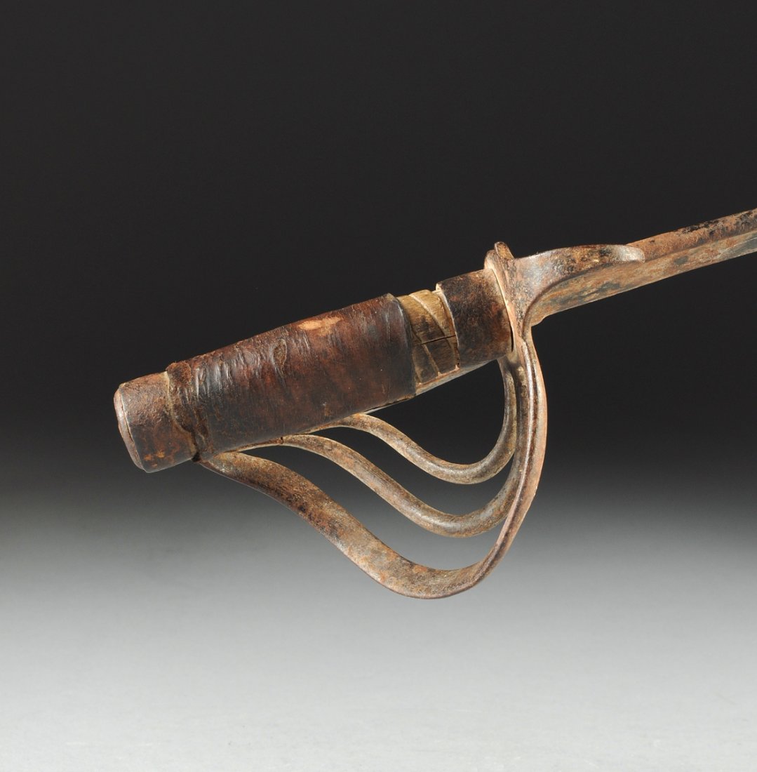 Spanish/Mexican military iron sword, cIRCA 1800,: Spanish/Mexican military iron sword, cIRCA 1800, curved blade, guard with a leather grip. Height: 32"