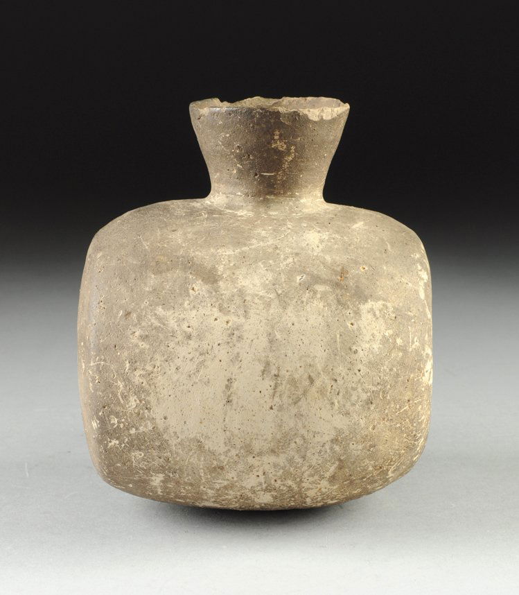 A CHINESE ARCHAISTIC EARTHENWARE PORTABLE VESSEL,: A CHINESE ARCHAISTIC EARTHENWARE PORTABLE VESSEL, POSSIBLY WARRING STATES PERIOD (475-221 B.C.), of circular barrel form centering a short flaring conical spout above sides centering paired incised li