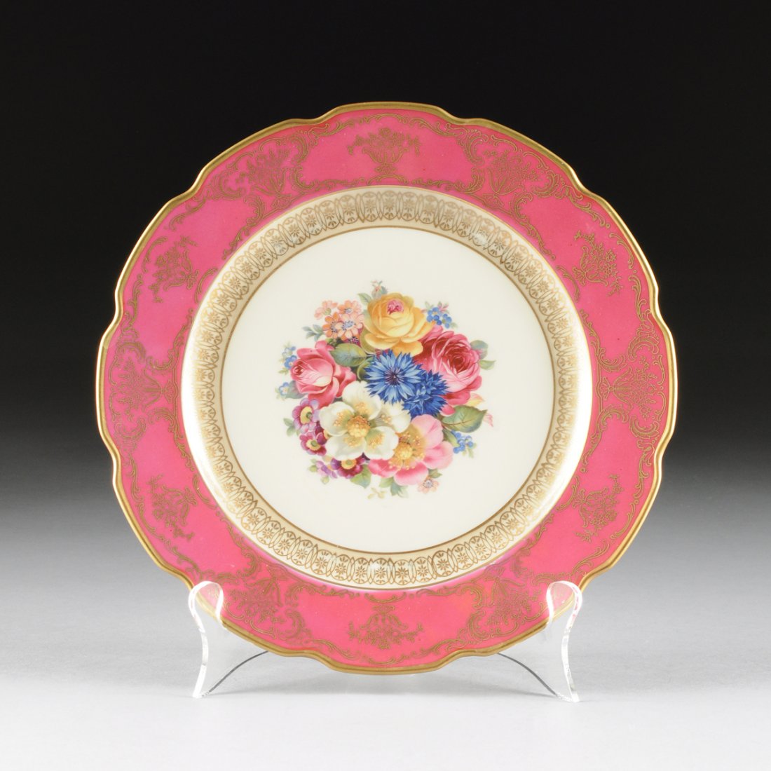 A SET OF THIRTEEN VINTAGE GERMAN PARCEL GILT PINK: A SET OF THIRTEEN VINTAGE GERMAN PARCEL GILT PINK GROUND AND FLORAL DECORATED DINNER PLATES, BY SCHUMANN, BAVARIA, OVERGLAZE BLUE MARKS, 1918-1929, each with a shaped gilt rim having a border of gilt