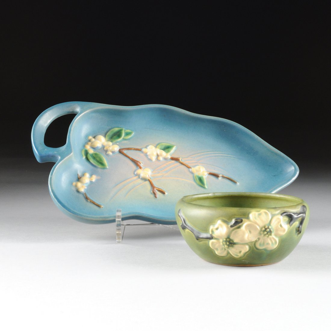 TWO ROSEVILLE ART POTTERY ITEMS, ZANESVILLE, OHIO,: TWO ROSEVILLE ART POTTERY ITEMS, ZANESVILLE, OHIO, CIRCA 1920-1950, comprising a "Dogwood II" pattern (introduced in 1920) bowl with flowering dogwood branches in black and ivory on smooth green groun