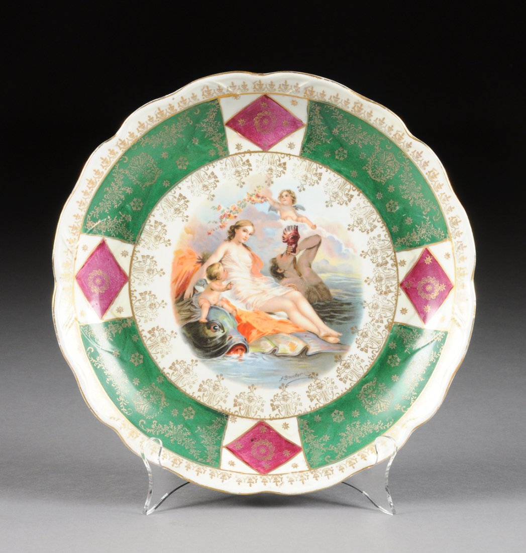 A ROYAL VIENNA STYLE PARCEL GILT AND POLYCHROME: A ROYAL VIENNA STYLE PARCEL GILT AND POLYCHROME DECORATED DISPLAY DISH, EARLY 20TH CENTURY, of shallow circular form and centering a reserve depicting a voluptuous Venus with long wavy brown hair and 