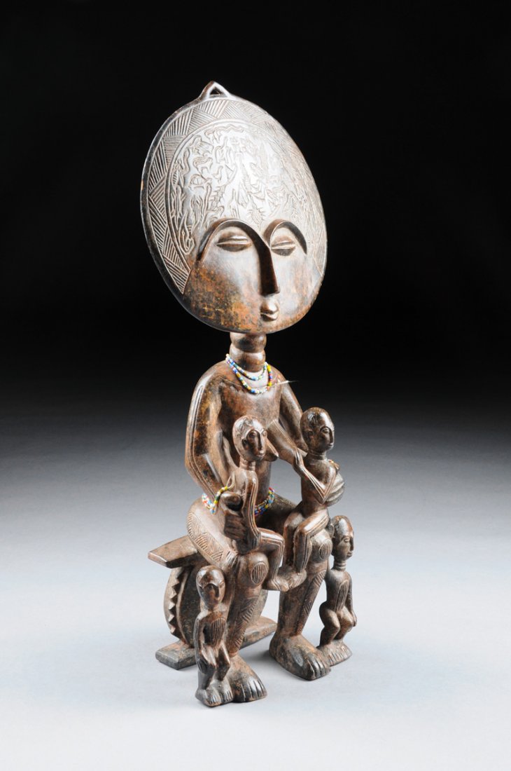 AN AFRICAN CARVED WOOD FERTILITY FIGURAL GROUP, (1 of 4)