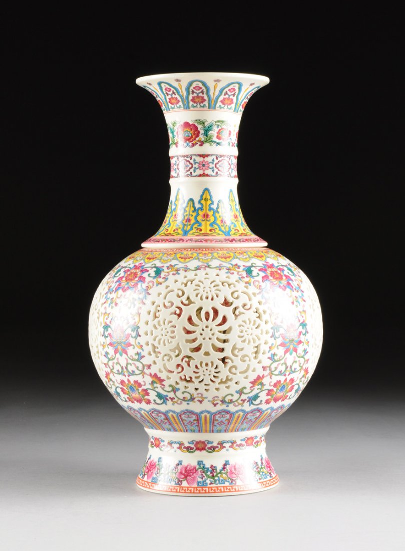 A CHINESE FAMILLE ROSE PORCELAIN RETICULATED CASED VASE (1 of 10)