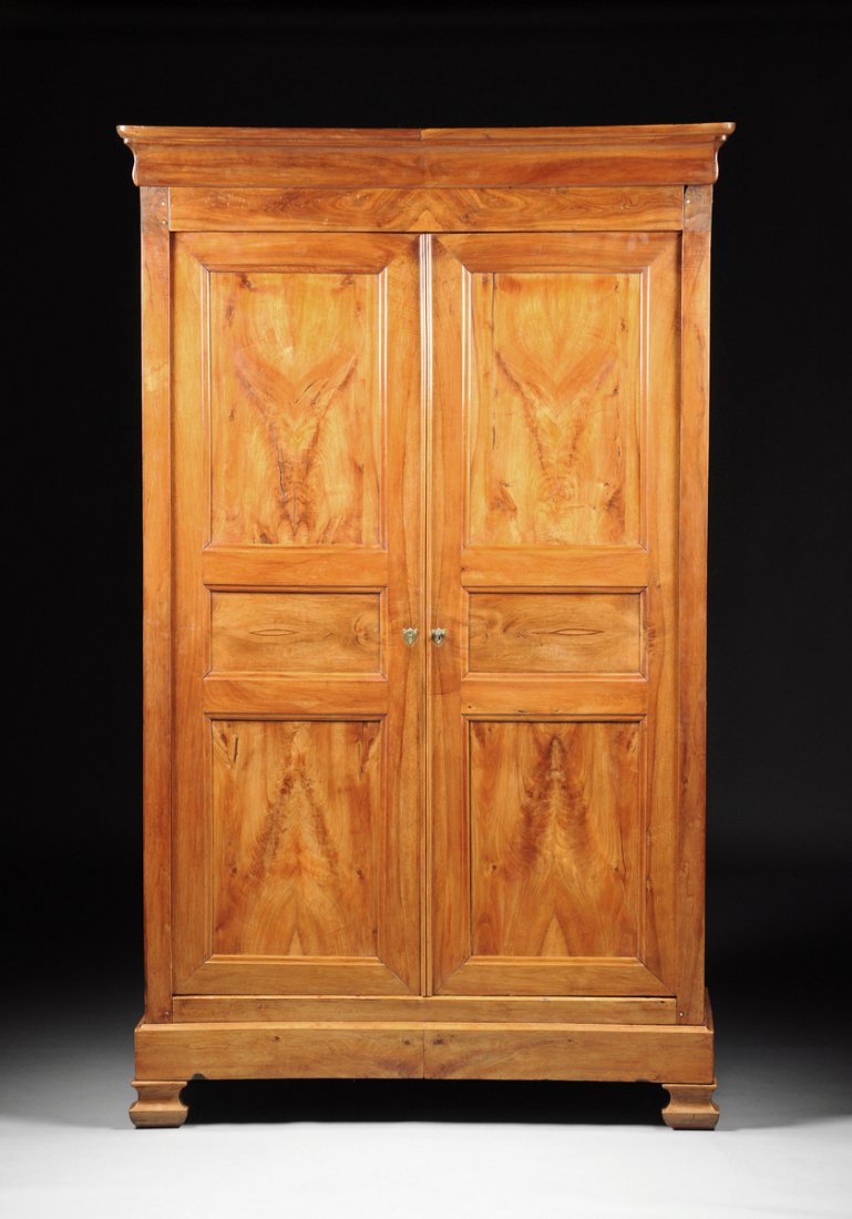 A FRENCH PROVINCIAL CARVED CHERRY ARMOIRE, EARLY 19TH C (1 of 10)