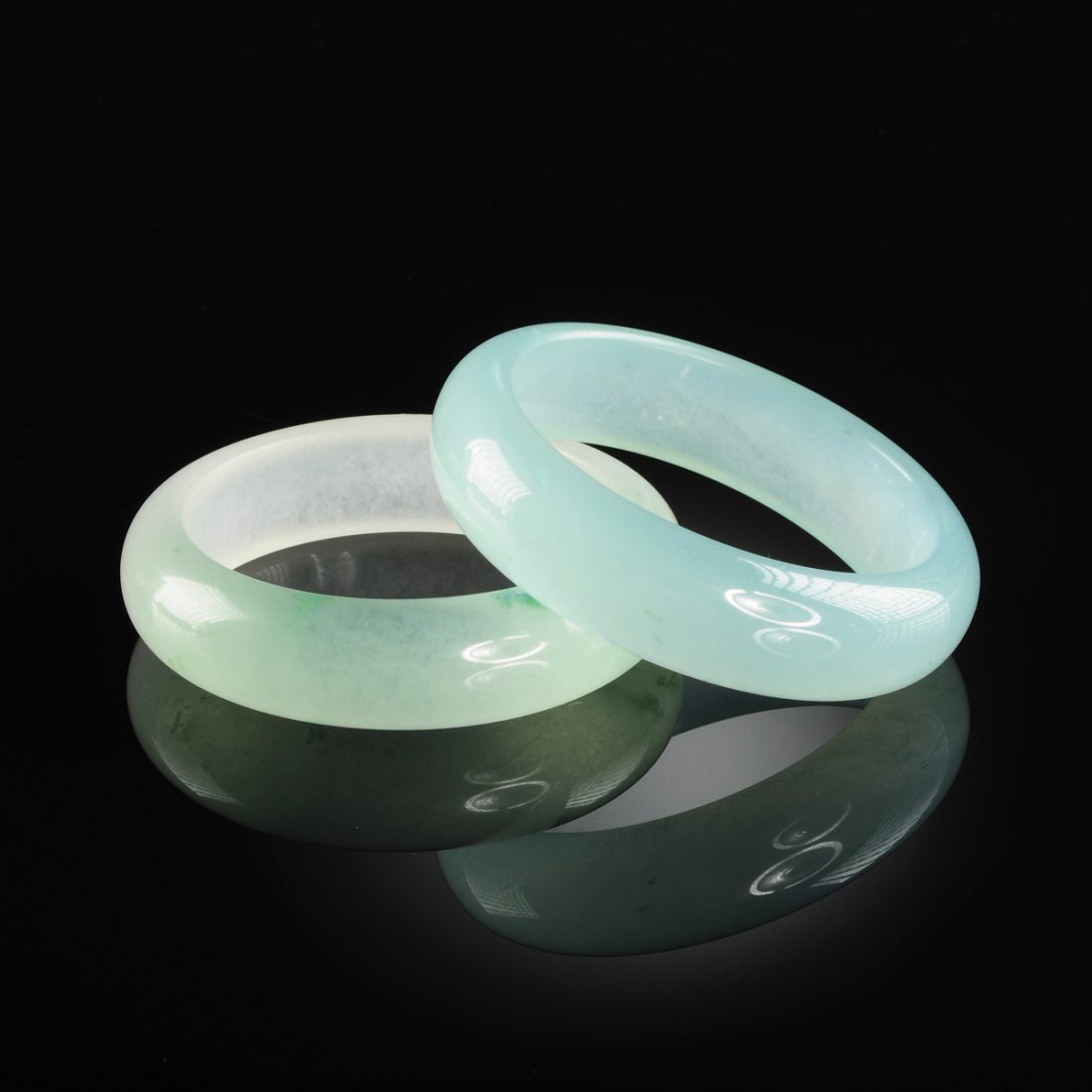 TWO CHINESE CARVED CELADON JADE BANGLE BRACELETS, MODER (1 of 2)