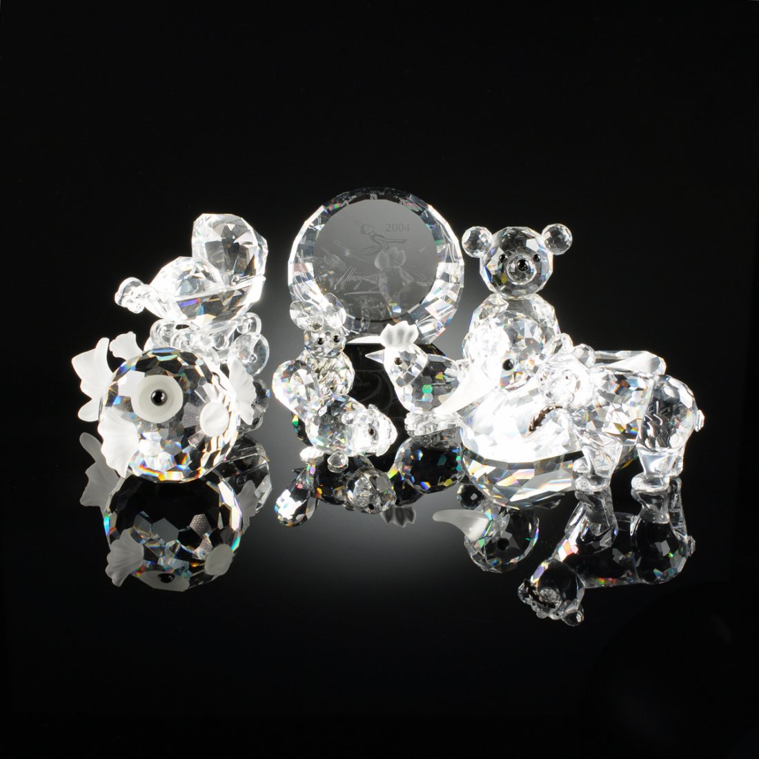 A GROUP OF NINE SWAROVSKI CRYSTAL FIGURES, EACH SIGNED, (1 of 10)