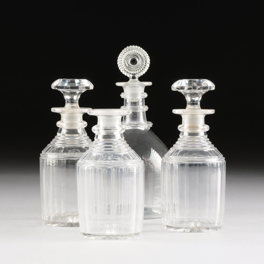 A GROUP OF FOUR GEORGIAN CUT CRYSTAL DECANTERS, LATE 18 (1 of 9)