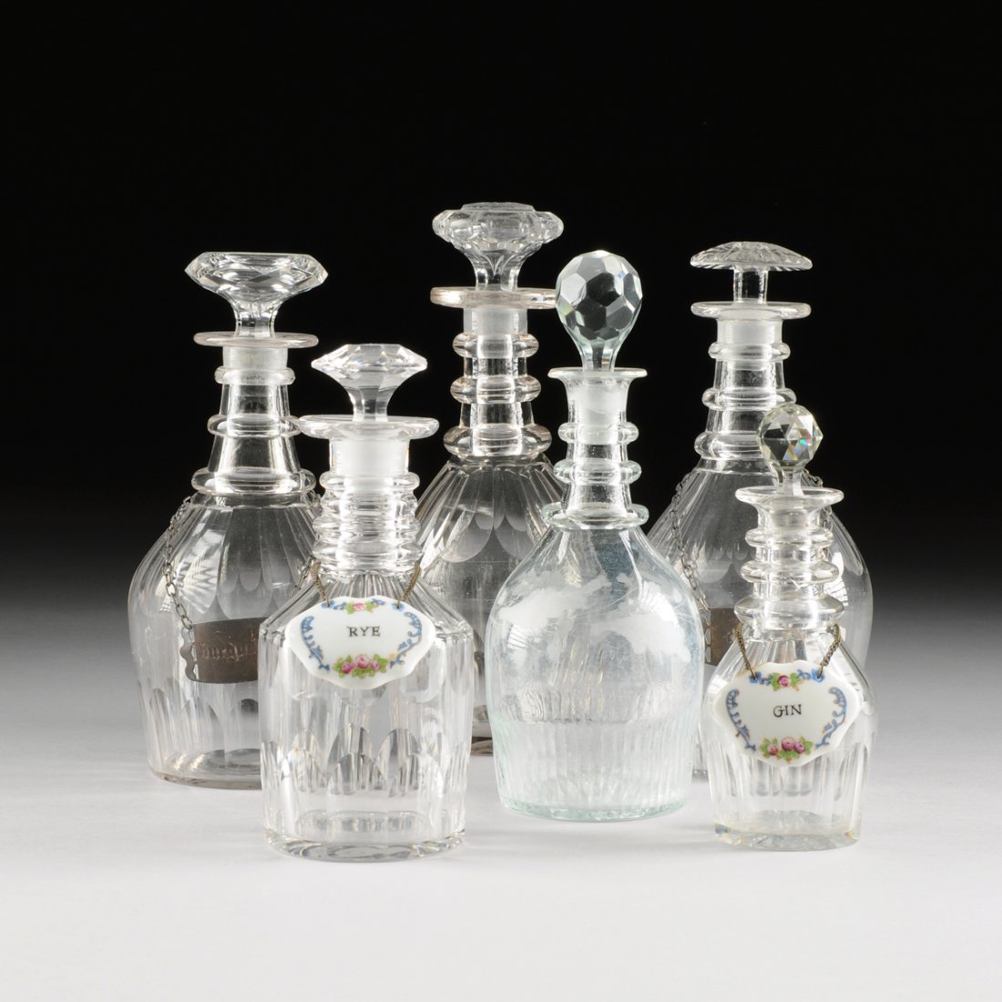 A GROUP SIX ANGLO/IRISH REGENCY PERIOD CUT GLASS DECANT (1 of 8)