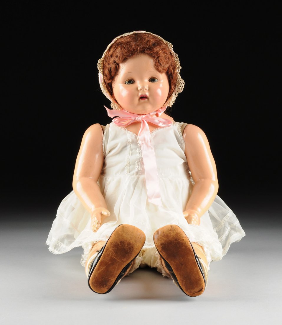 AN EFFANBEE "MAE STARR" PHONOGRAPH DOLL, CIRCA: AN EFFANBEE "MAE STARR" PHONOGRAPH DOLL, CIRCA 1928-1944, the doll with composition head, shoulders, and limbs and cloth body, the head with lashed hazel sleep eyes, auburn human hair wig, and open mo