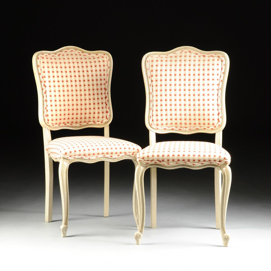 A SET OF FOUR LOUIS XV STYLE WHITE PAINTED AND: A SET OF FOUR LOUIS XV STYLE WHITE PAINTED AND UPHOLSTERED CARVED WOOD CHAISES, 20TH CENTURY, each with an arched crestrail centering foliate details, on a serpentine rectangular padded back, above a