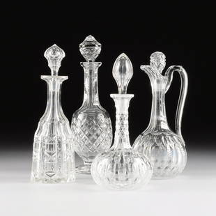 A WATERFORD CRYSTAL WINE DECANTER, "CASTLETOWN": A WATERFORD CRYSTAL WINE DECANTER, "CASTLETOWN" PATTERN, SIGNED, 20TH CENTURY, the footed vessel with multifaceted and diamond patterned stopper over an upturned lip and long paneled neck leading