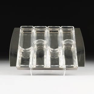 A CONTEMPORARY ITALIAN GLASS AND STAINLESS STEEL: A CONTEMPORARY ITALIAN GLASS AND STAINLESS STEEL CONDIMENTS TRAY, BY ZANI & ZANI, ACCAI PER LA CASI, SIGNED, the rectangular two handled stainless steel tray fitted with conforming undulating glass