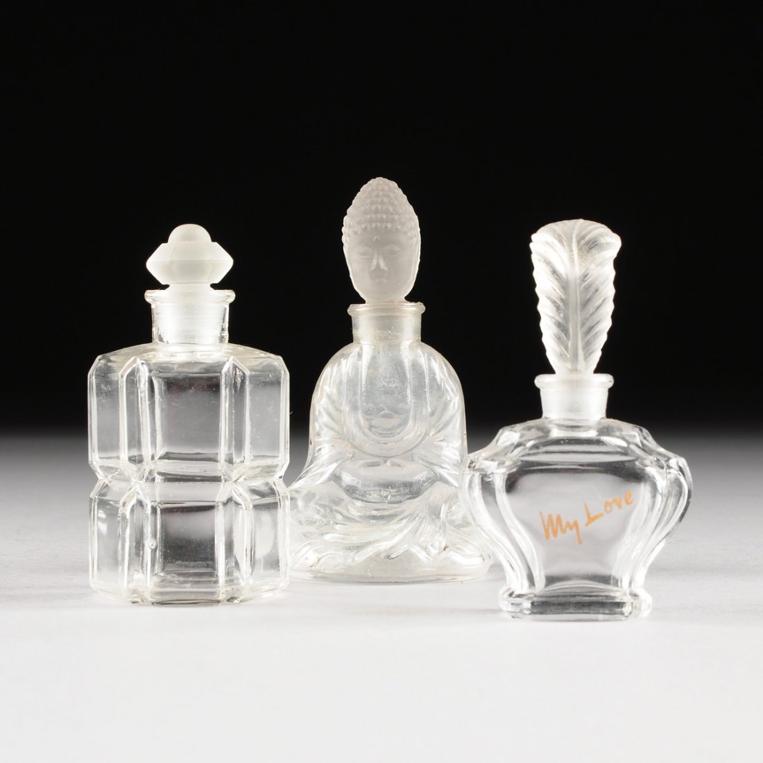 A GROUP OF THREE FROSTED AND CLEAR MOLDED GLASS PERFUME (1 of 10)