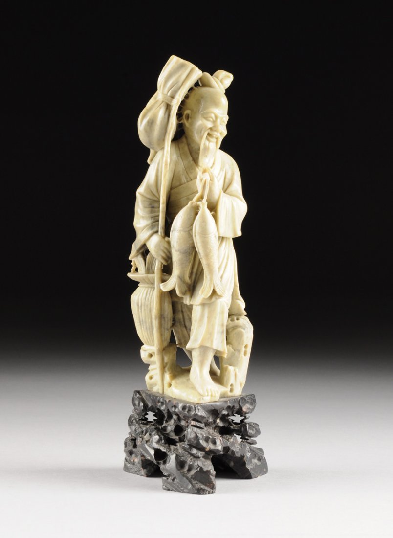 A CHINESE CARVED SOAPSTONE FIGURE OF AN IMMORTAL, 20TH (1 of 8)