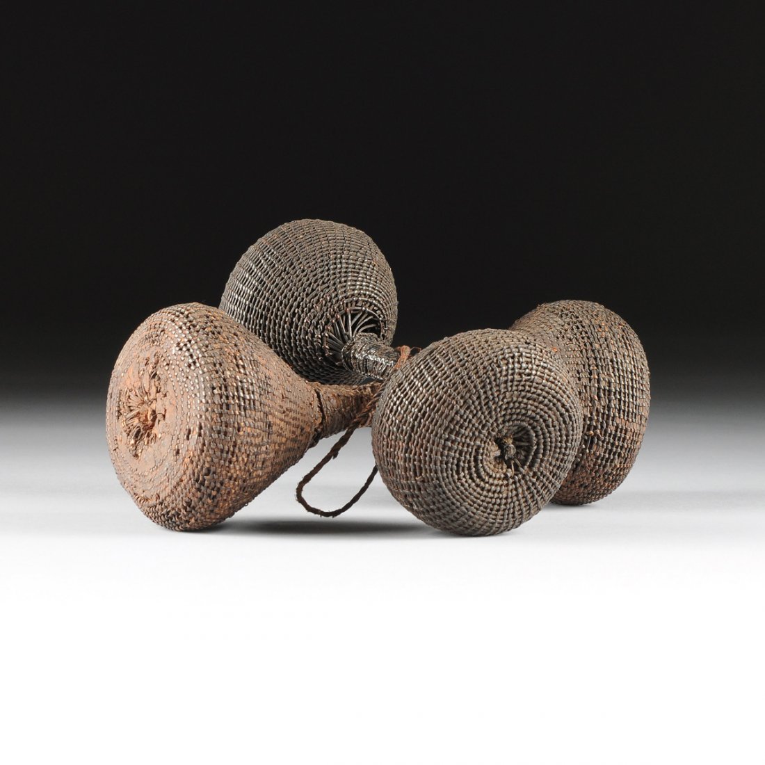 A PAIR OF AFRICAN TRIBAL BROWN PAINTED WOVEN SISAL (1 of 8)