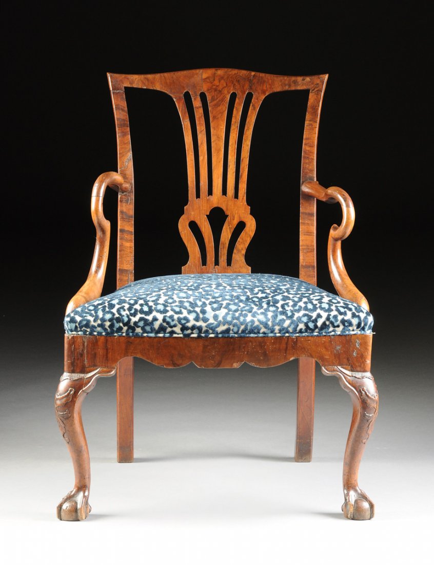 A DUTCH GEORGE III WALNUT AND MAHOGANY OPEN ARMCHAIR,: A DUTCH GEORGE III WALNUT AND MAHOGANY OPEN ARMCHAIR, LATE 18TH CENTURY, in the manner of Thomas Chippendale (English 1718-1779), the subtly shaped crest rail over a walnut veneered central baluster f