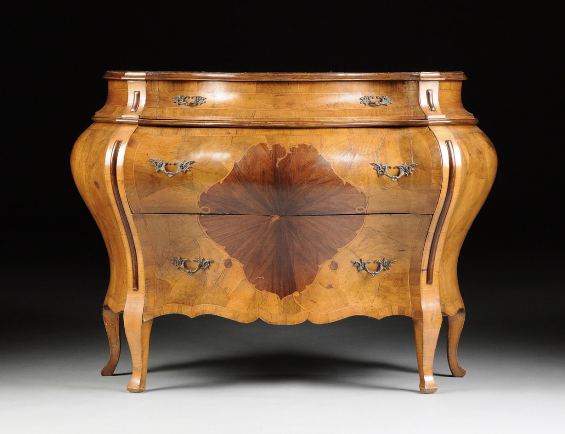 AN ITALIAN ROCOCO STYLE CARVED WALNUT BOMBE CHEST OF DR (1 of 8)