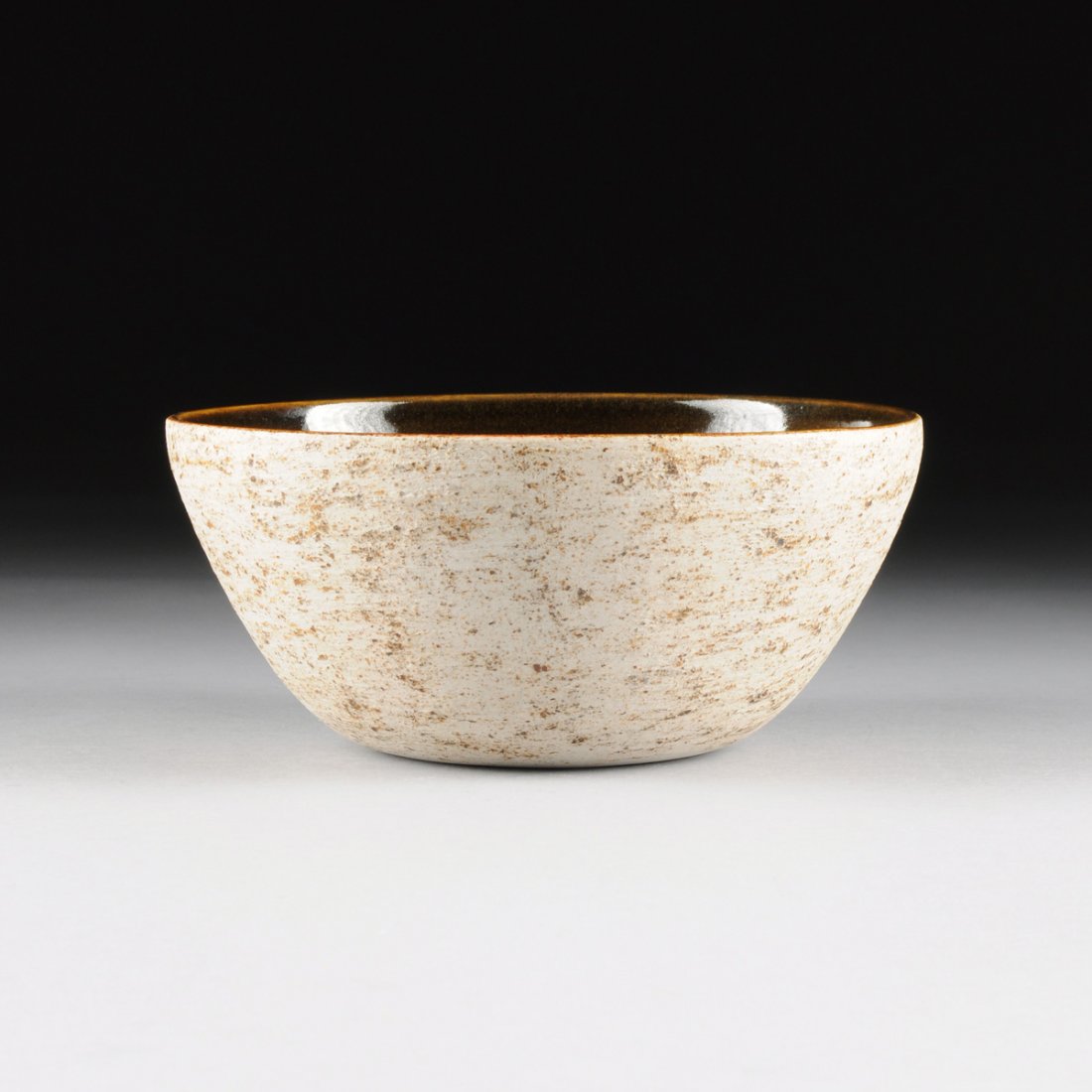 A BROWN AND EGGSHELL GLAZED PORCELAIN CENTER BOWL, (1 of 5)
