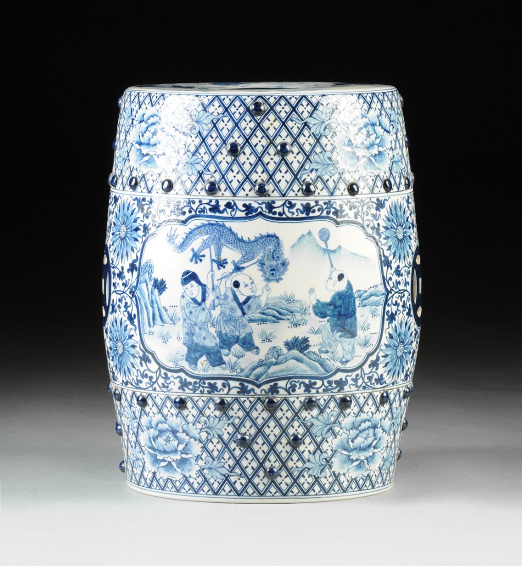 A CHINESE BLUE AND WHITE PORCELAIN GARDEN STOOL, LATE: A CHINESE BLUE AND WHITE PORCELAIN GARDEN STOOL, LATE 20TH CENTURY, of traditional barrel form with a flat top showing frolicking boys amidst an outdoor setting with a distant mountainous landscape, e