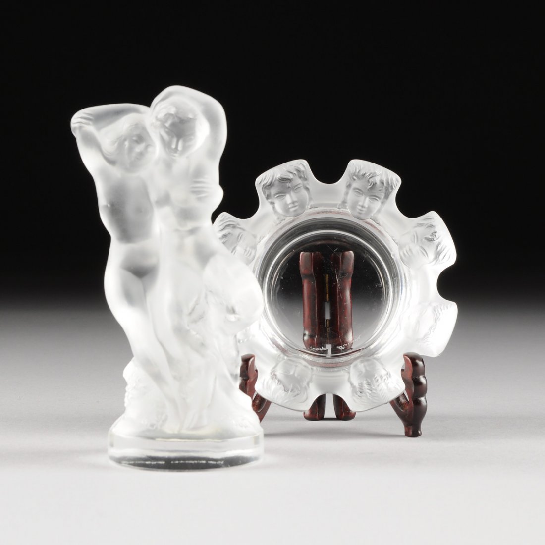 TWO LALIQUE FROSTED GLASS PIECES, SAINT NICHOLAS AND: TWO LALIQUE FROSTED GLASS PIECES, SAINT NICHOLAS AND FAUN PATTERNS, ENGRAVED SIGNATURES, MODERN, comprising a diminutive Saint Nicholas cendrier of tapering circular form and a rim of rectangular tabs