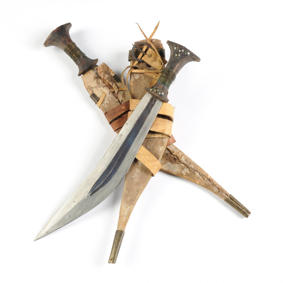 TWO TRIBAL CARVED WOOD AND DOUBLE EDGED STEEL KNIVES, (1 of 10)