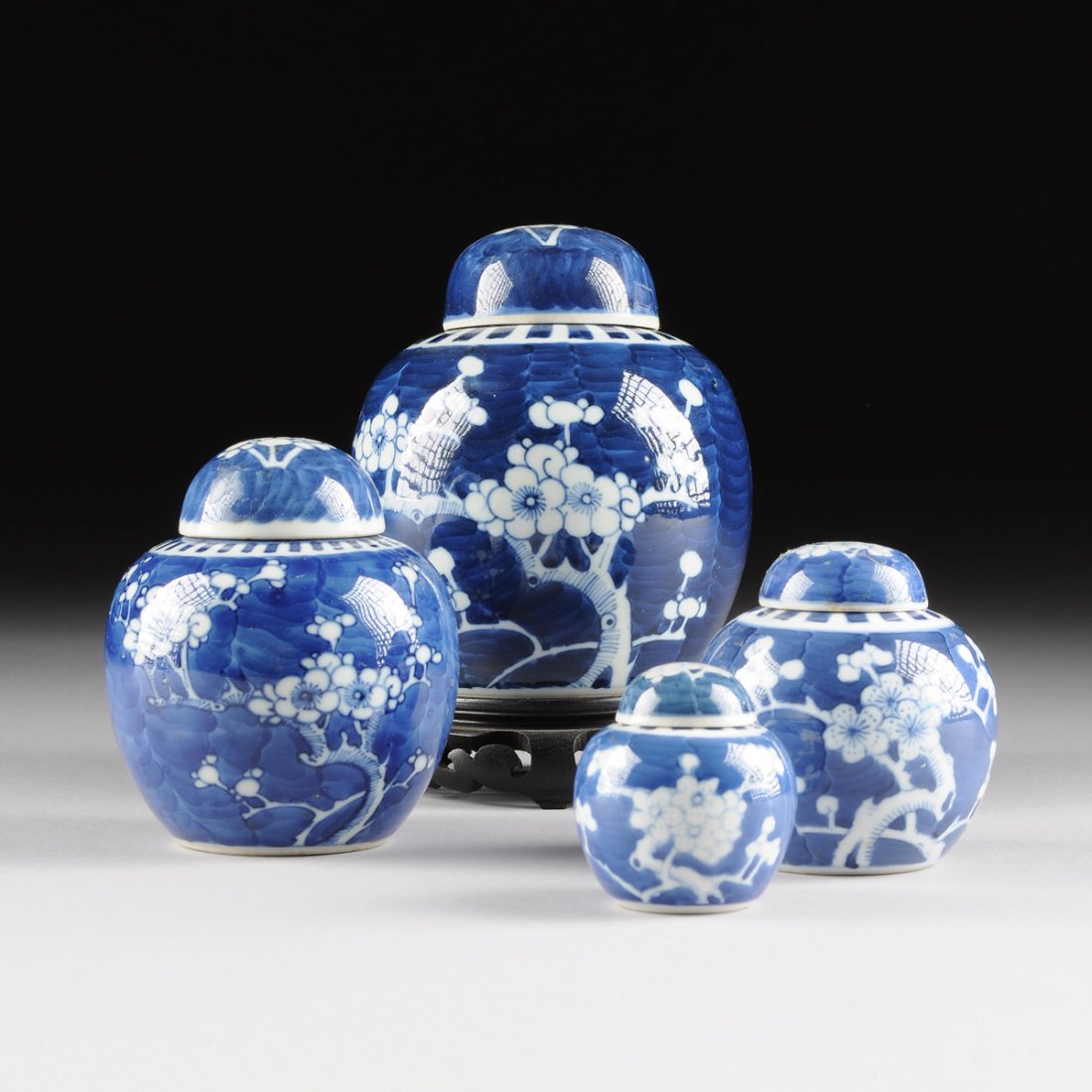 A SET OF FOUR CHINESE BLUE AND WHITE LIDDED GINGER (1 of 10)