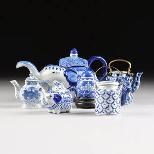 A GROUP OF SIX CHINESE/THAI SMALL BLUE AND WHITE: A GROUP OF SIX CHINESE/THAI SMALL BLUE AND WHITE PORCELAIN TEA WARES, MODERN, comprising an elephant form teapot, height: 6", length: 10 1/4"; one small elephant form teapot with elephant form teapot