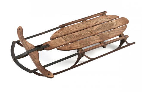 A VINTAGE "SPEEDWAY" CHILD'S SNOW SLED, EARLY 20TH: A VINTAGE "SPEEDWAY" CHILD'S SNOW SLED, EARLY 20TH CENTURY, with wood slats centering black, "SPEEDWAY," before a shaped wood directional yolk, on red painted metal slides, height: 6", length: 38 1/4"