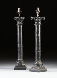 A PAIR OF ROMANESQUE REVIVAL BLACK PAINTED CARVED WOOD: A PAIR OF ROMANESQUE REVIVAL BLACK PAINTED CARVED WOOD COLUMNAR LAMPS, THE COLUMNS SECOND HALF 19TH CENTURY, each with a stylized leaf and flower detailed capital, on a cylindrical column and conformi