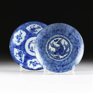 TWO BLUE AND WHITE PLATES,: TWO BLUE AND WHITE PLATES, one with stylized floral decoration and the other centering a fish surrounded by lotus leaves. 11 1/4" in diameter and 10 1/2" in diameter respectively.