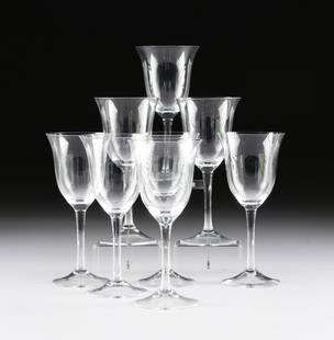 A SET OF EIGHT CRYSTAL RED WINE STEMWARE,: A SET OF EIGHT CRYSTAL RED WINE STEMWARE, each with flared rim cut detailed bowl on a tapering circular stem ending on a conforming base. Modern. Height: 8 1/2"