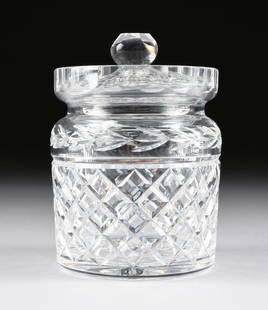 A WATERFORD CUT CRYSTAL LIDDED BISCUIT BARREL, GLANDORE: A WATERFORD CUT CRYSTAL LIDDED BISCUIT BARREL, GLANDORE PATTERN, SIGNED, MODERN, detailed in traditional Glandore pattern and underside enclosing a large stylized star with the "Waterford" mark, surmo