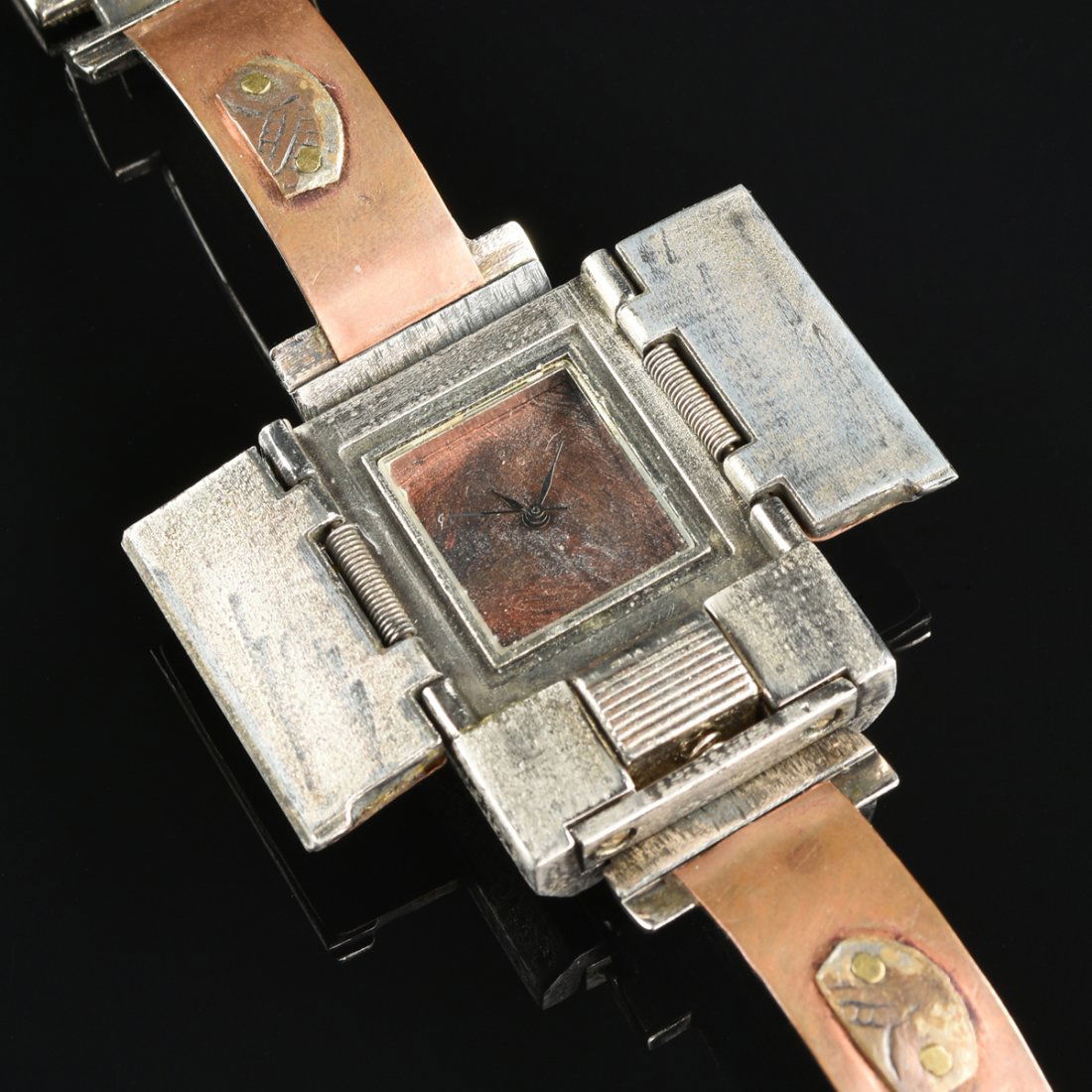 A HAND-CRAFTED SILVER, COPPER, AND BRASS WRISTWATCH BY (1 of 5)