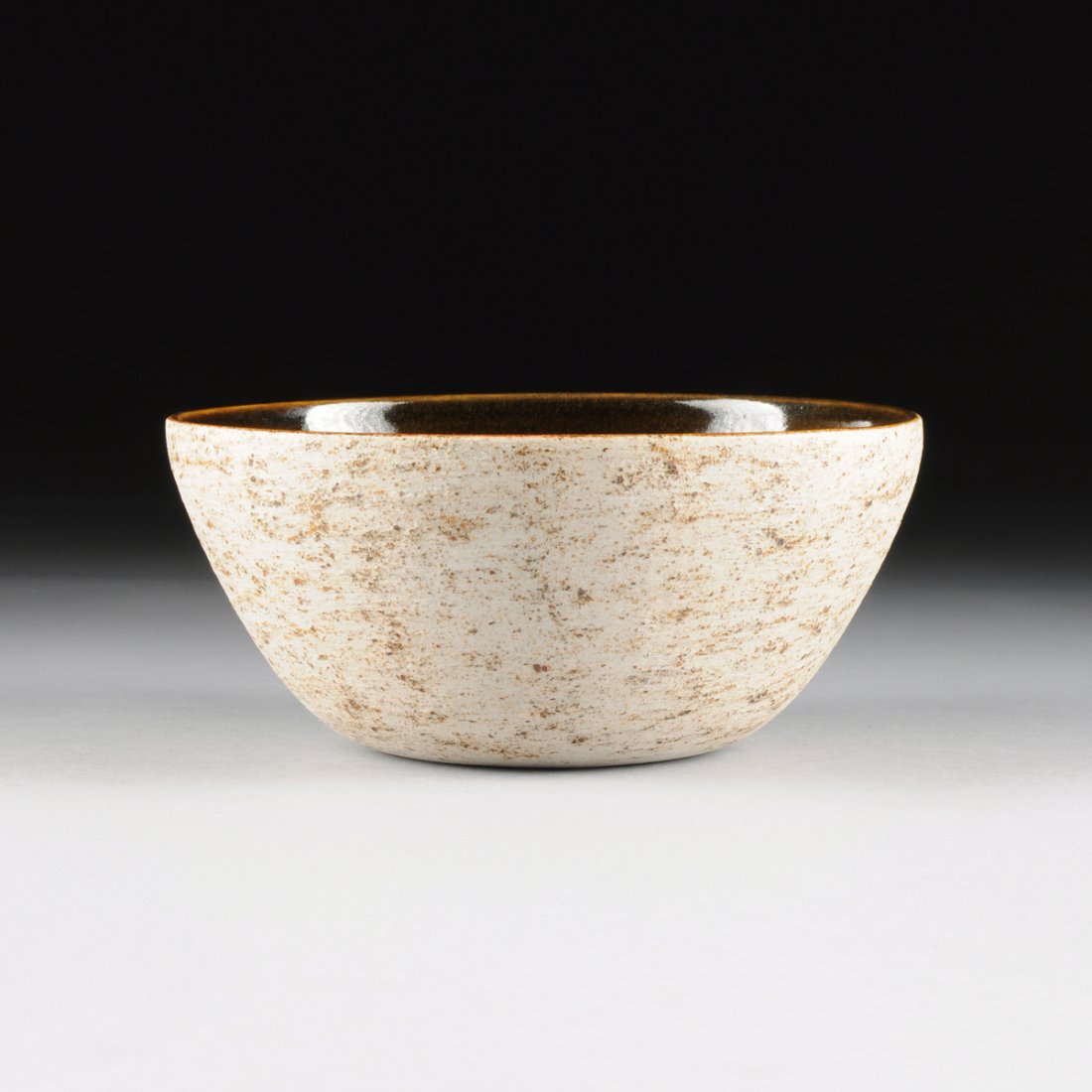 A BROWN AND EGGSHELL GLAZED PORCELAIN CENTER BOWL, (1 of 5)