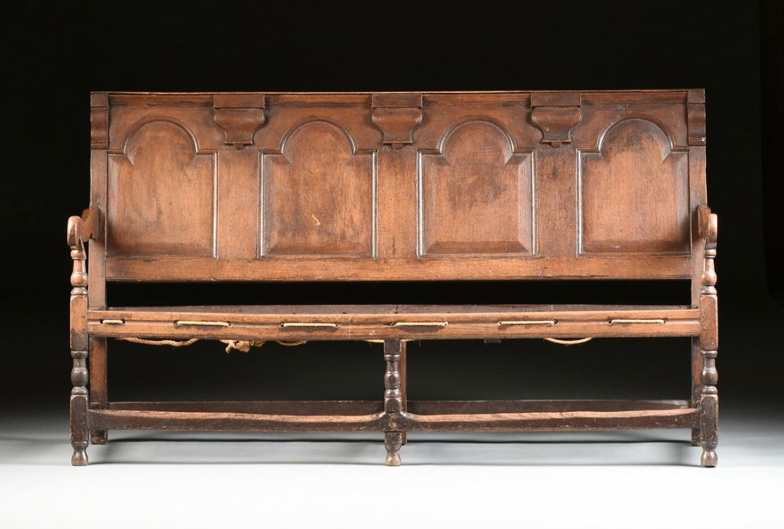 A CHARLES II CARVED OAK PANELED SETTLE, (1 of 8)