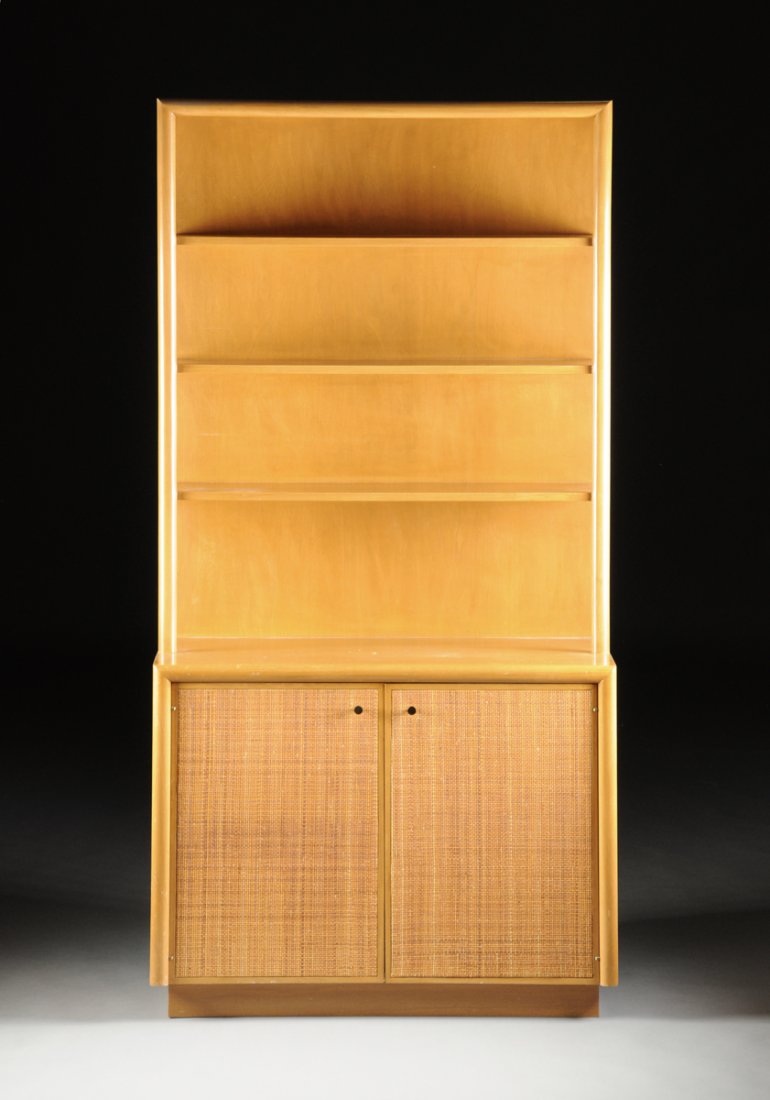 ELIAS SVEDBERG (Swedish 1913-1987) A SYCAMORE, MAPLE,: ELIAS SVEDBERG (Swedish 1913-1987) A SYCAMORE, MAPLE, AND CANE BOOKCASE, FOR NORDISKA KOMPANIENT, STOCKHOLM, SWEDEN, CIRCA 1955, with two cane fronted doors at the base surmounted by three open partia