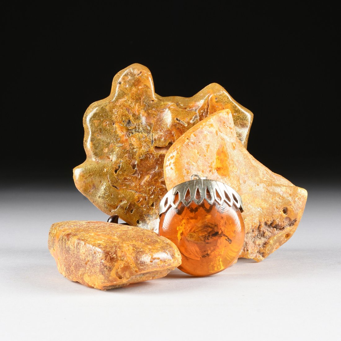 A GROUP OF FOUR NATURAL AMBER FRAGMENTS, (1 of 5)