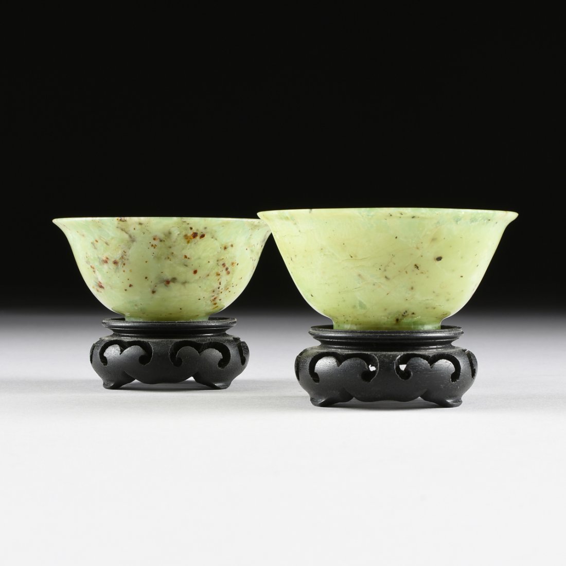 A PAIR OF CHINESE TRANSLUCENT MOTTLED GREEN JADE BOWLS, (1 of 8)