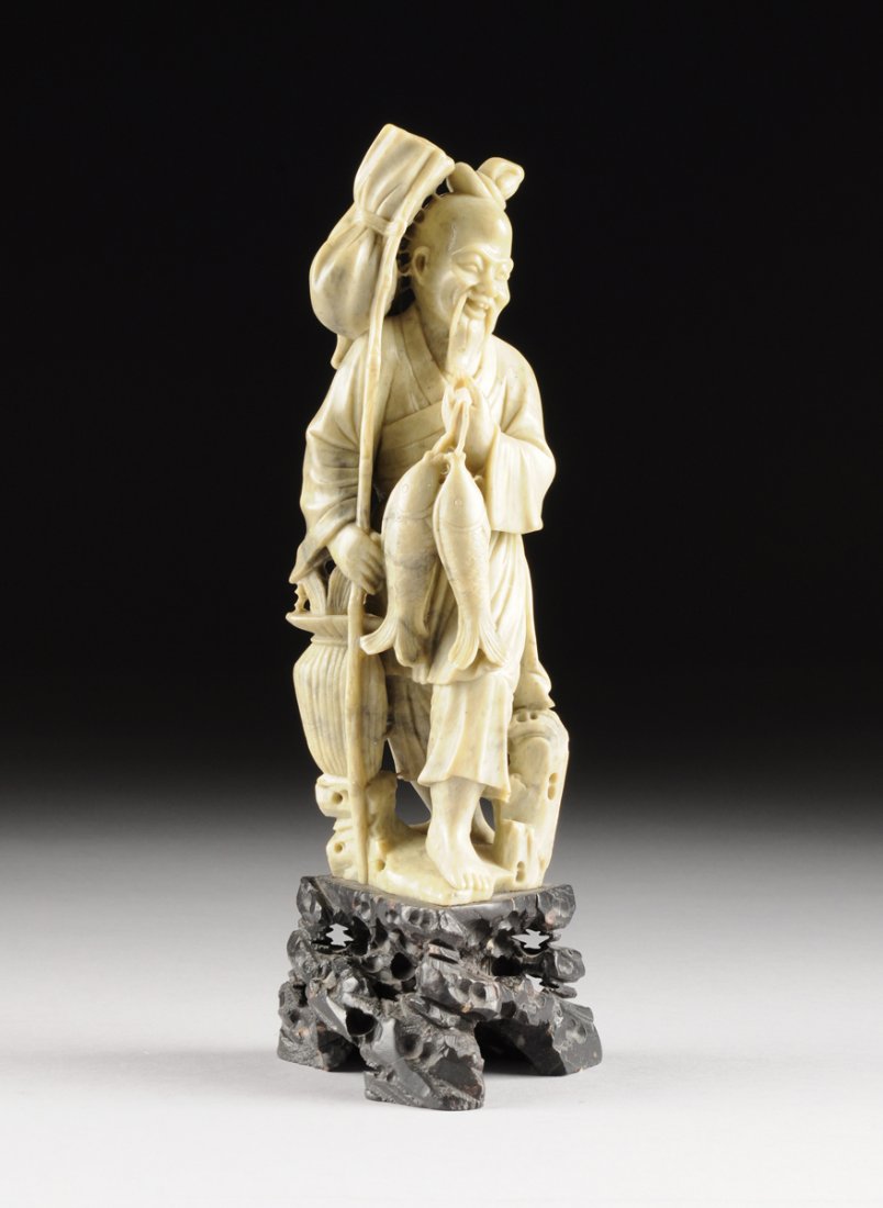 A CHINESE CARVED SOAPSTONE FIGURE OF AN IMMORTAL, 20TH (1 of 8)